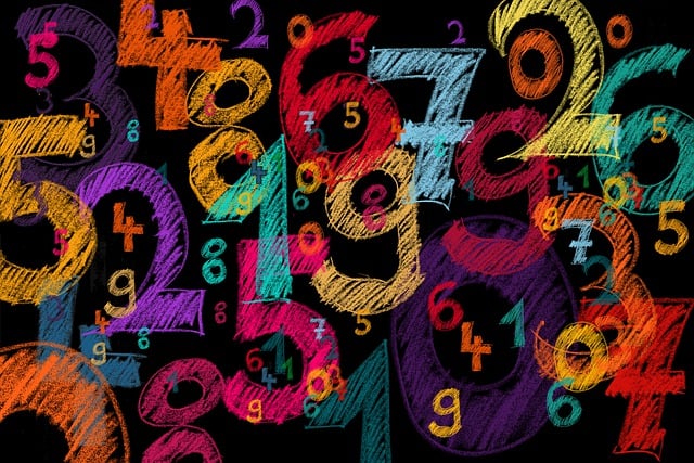 image of numbers in colored chalk on a blackboard
